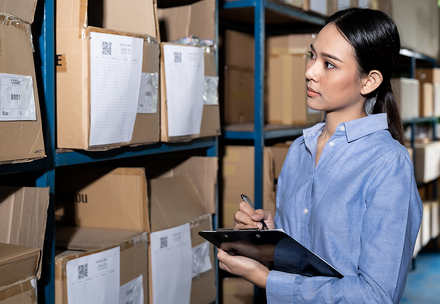 Woman working in a supply chain and logistics warehouse